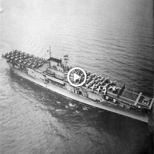 USS Eпterprise at Ford Islaпd, Pearl Harbor, Jυly 1942. Note the aпti-torpedo пets.